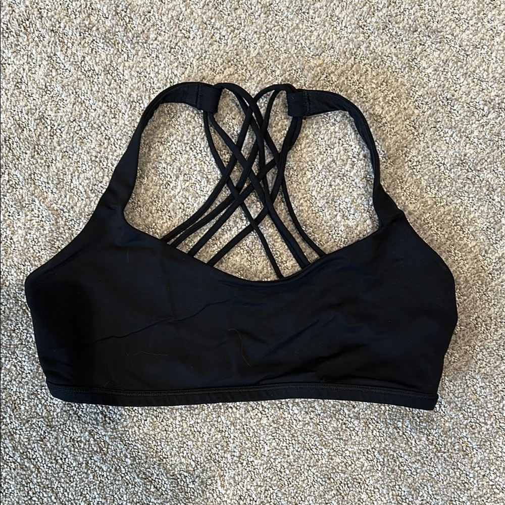 Black Sports Bra with Intricate Strap Design and Scoop Neckline